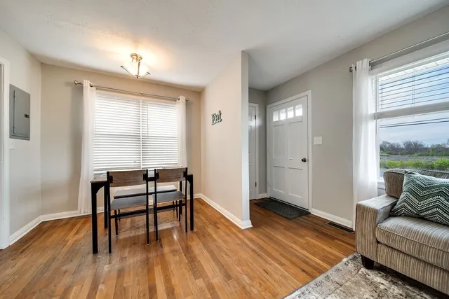 a view of a livingroom with furniture and wooden floor