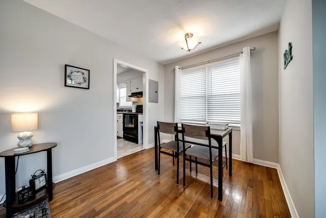 a view of a livingroom with furniture and a window