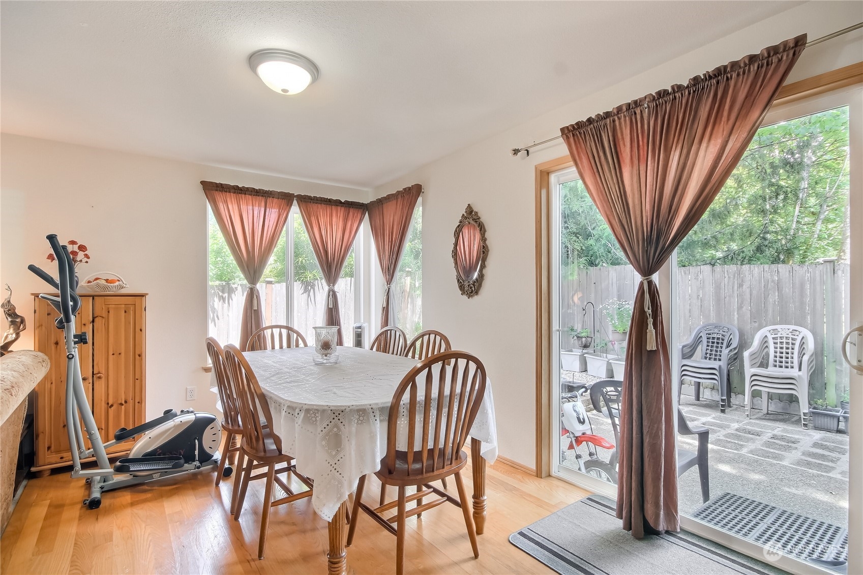 19910 142nd Place Southeast Renton, WA 98058 - Photo 14 of 38 a dining room with furniture window and wooden floor