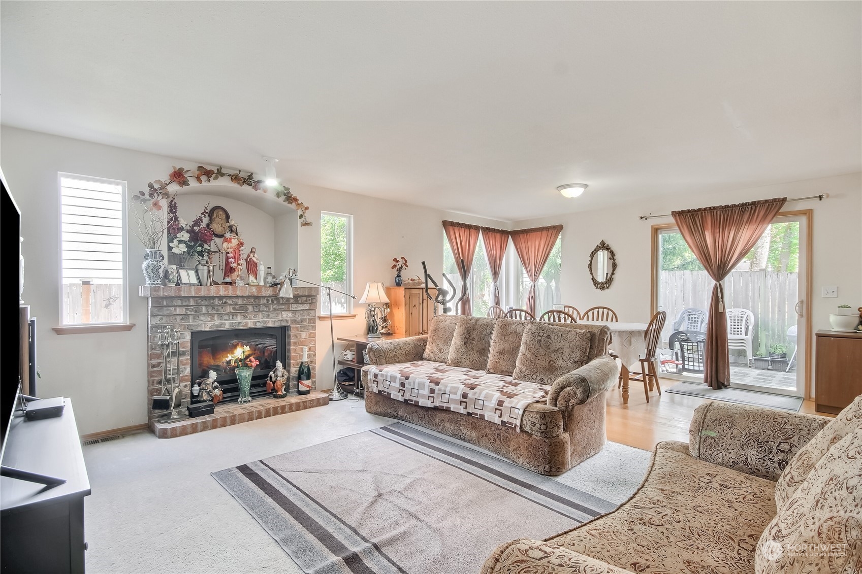 19910 142nd Place Southeast Renton, WA 98058 - Photo 15 of 38 a living room with furniture and a fireplace