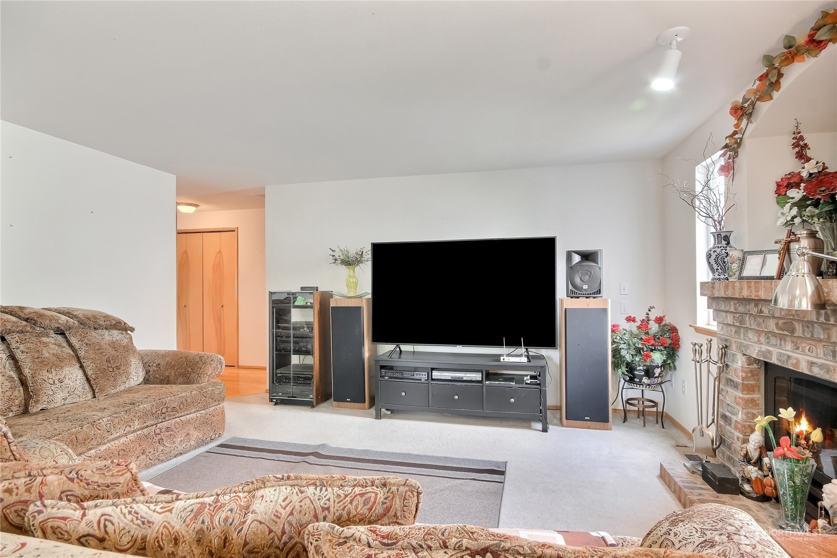 19910 142nd Place Southeast Renton, WA 98058 - Photo 16 of 38 a living room with furniture and a flat screen tv