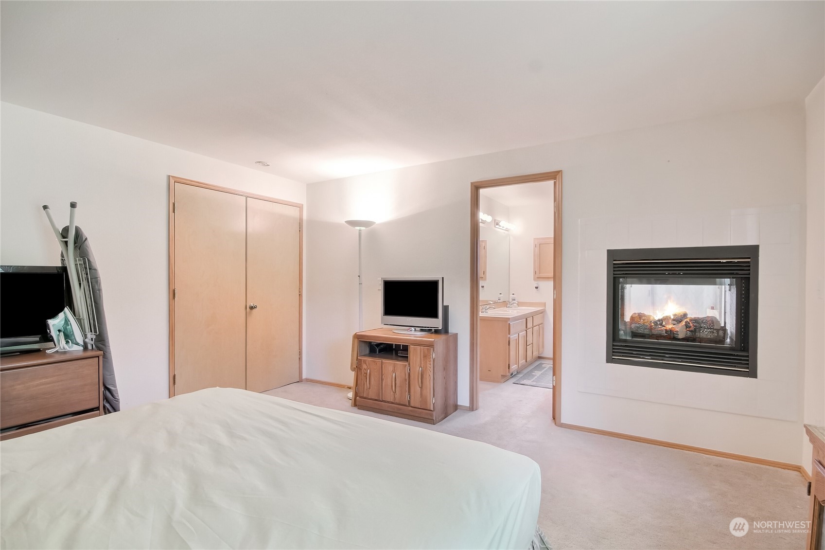 19910 142nd Place Southeast Renton, WA 98058 - Photo 18 of 38 a bedroom with a bed and a flat screen tv