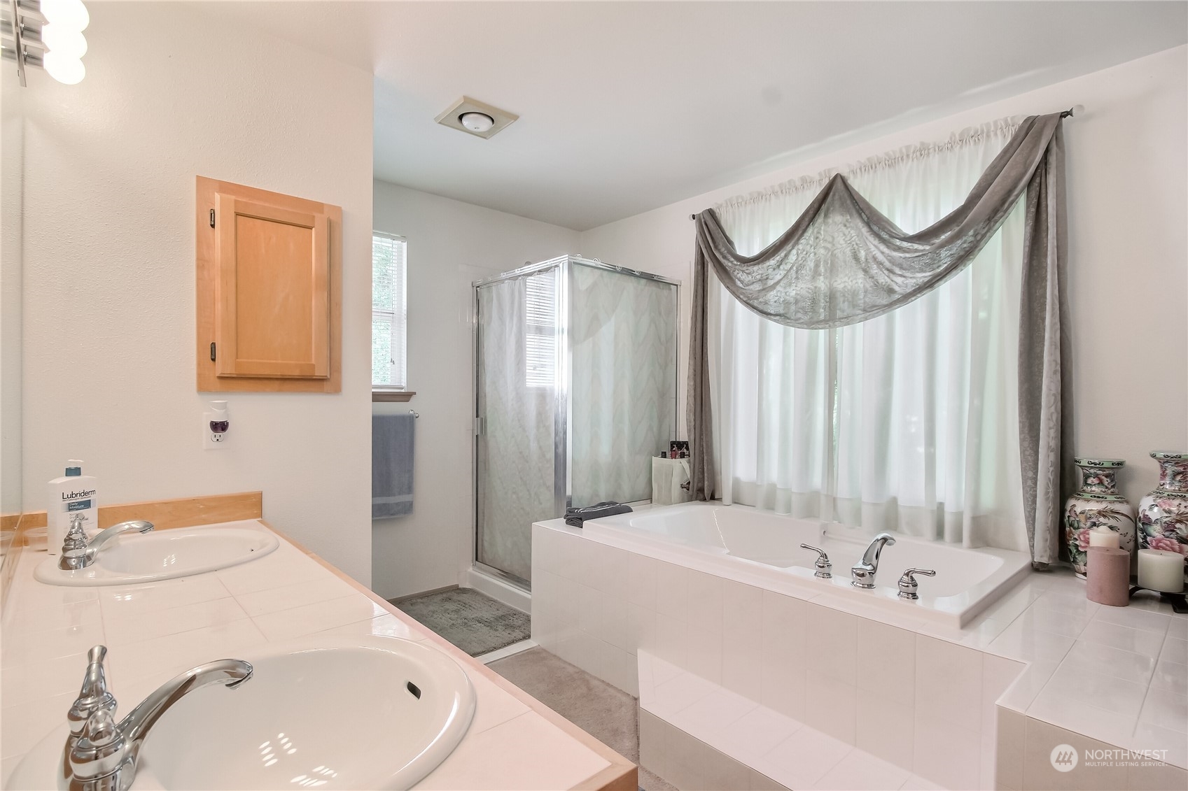19910 142nd Place Southeast Renton, WA 98058 - Photo 20 of 38 a bathroom with a sink and a mirror