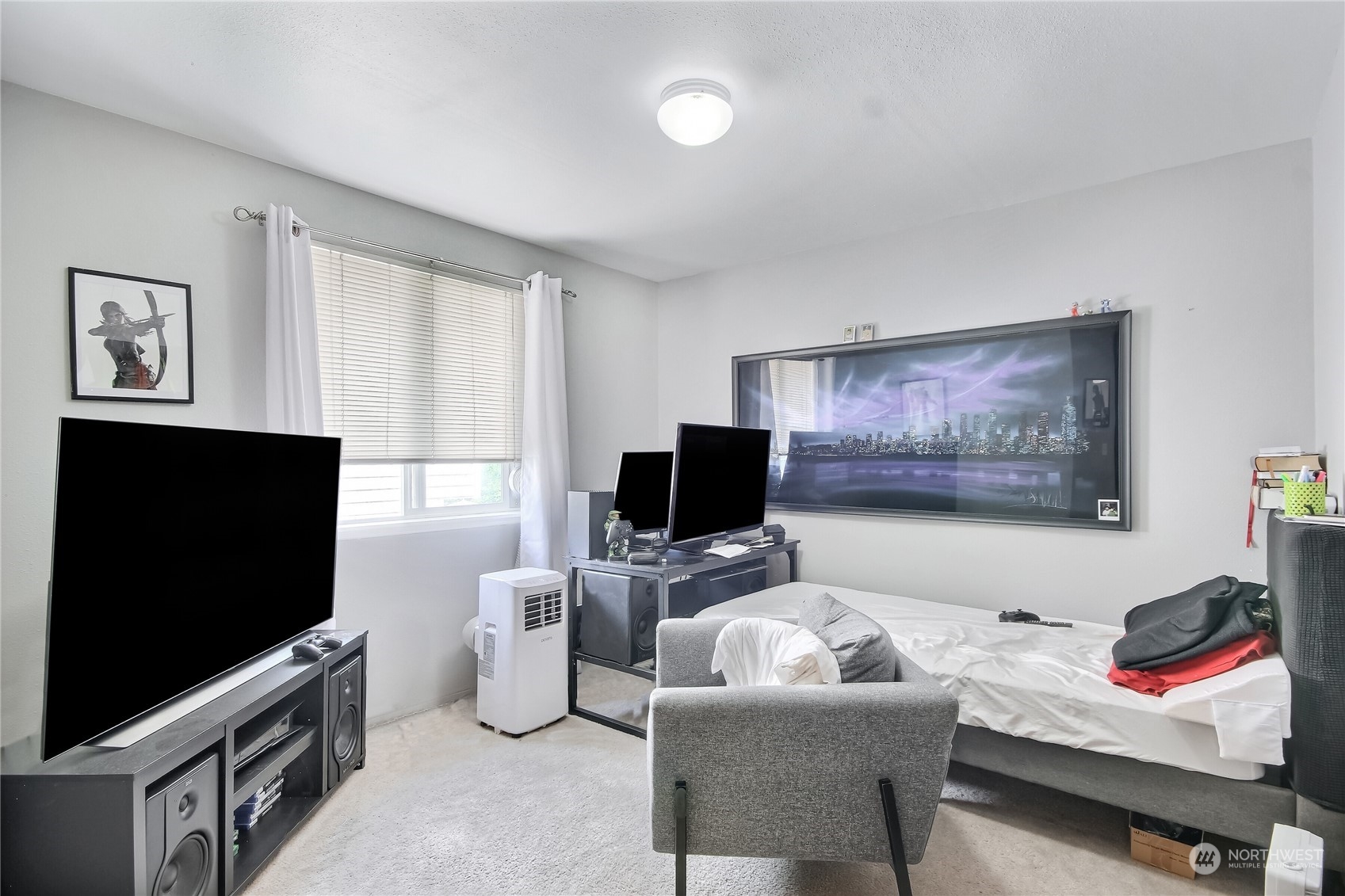 19910 142nd Place Southeast Renton, WA 98058 - Photo 21 of 38 a living room with furniture and a flat screen tv