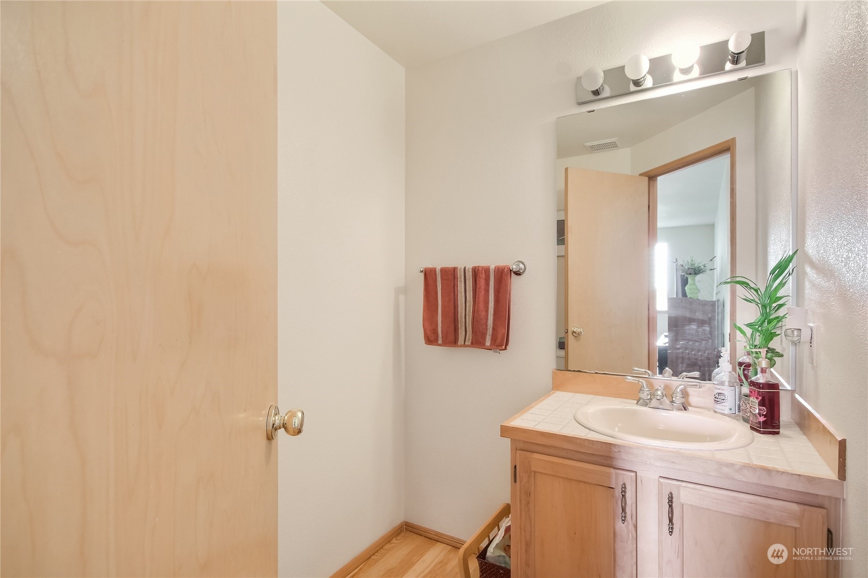 19910 142nd Place Southeast Renton, WA 98058 - Photo 24 of 38 a bathroom with a sink and a mirror