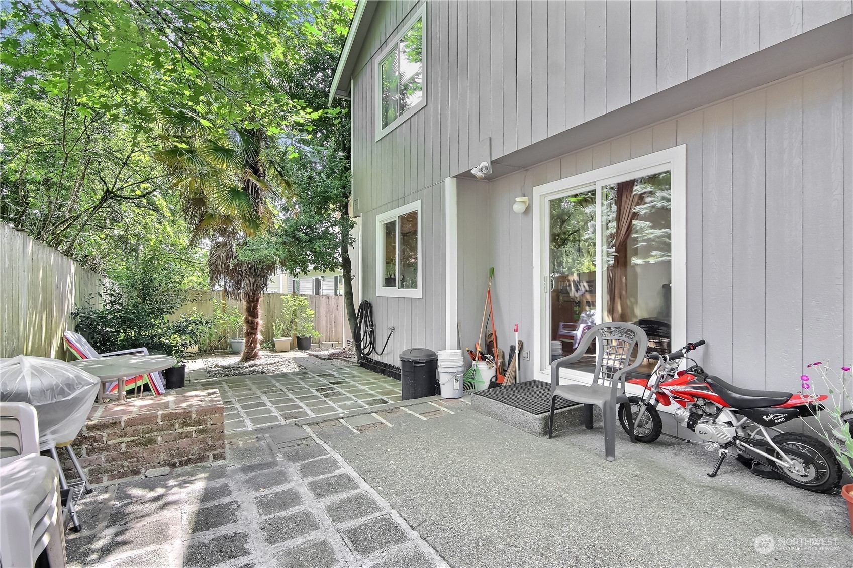 19910 142nd Place Southeast Renton, WA 98058 - Photo 30 of 38 a view of a patio with couple of chairs and potted plants