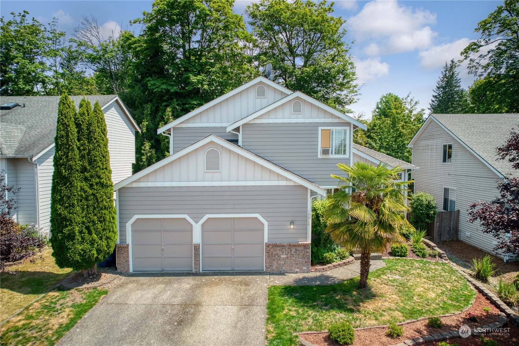 19910 142nd Place Southeast Renton, WA 98058 - Photo 3 of 38 a front view of house with a garden