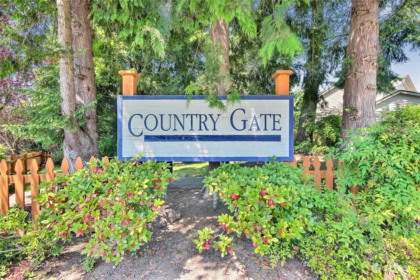 19910 142nd Place Southeast Renton, WA 98058 - Photo 35 of 38 a sign broad in front of flowers
