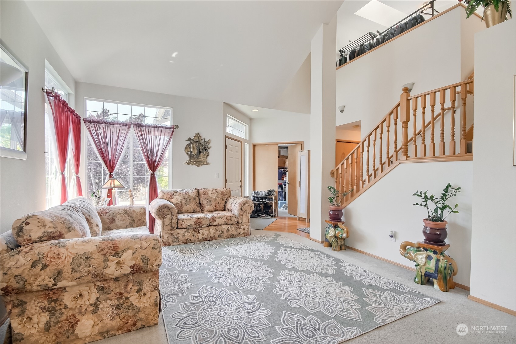 19910 142nd Place Southeast Renton, WA 98058 - Photo 6 of 38 a living room with furniture and a potted plant