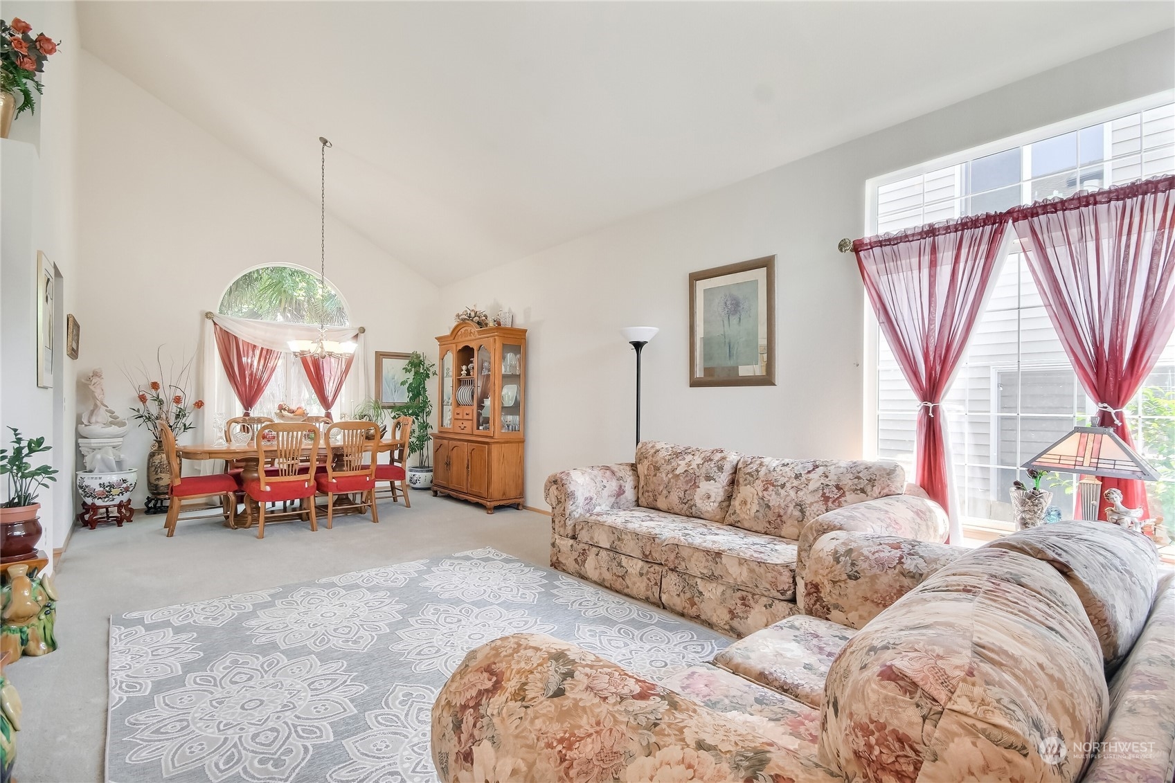 19910 142nd Place Southeast Renton, WA 98058 - Photo 7 of 38 a living room with furniture and a large window