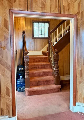 a view of an entryway with a chandelier