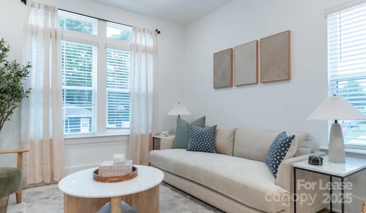 2619 Rozzelles Ferry Road Charlotte, NC 28208 - Photo 11 of 25 a living room with furniture and a window