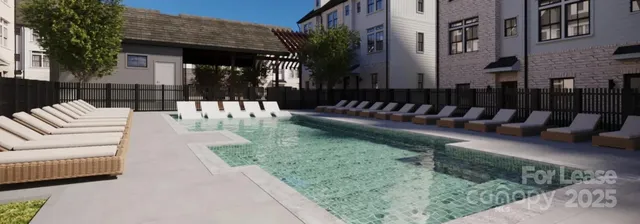 a view of a swimming pool with a lounge chairs