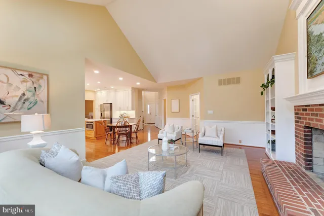 a living room with furniture a table and a flat screen tv