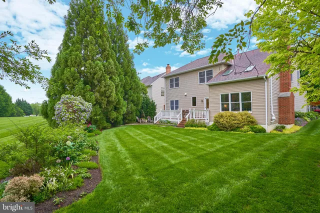 a living room with furniture and a piano