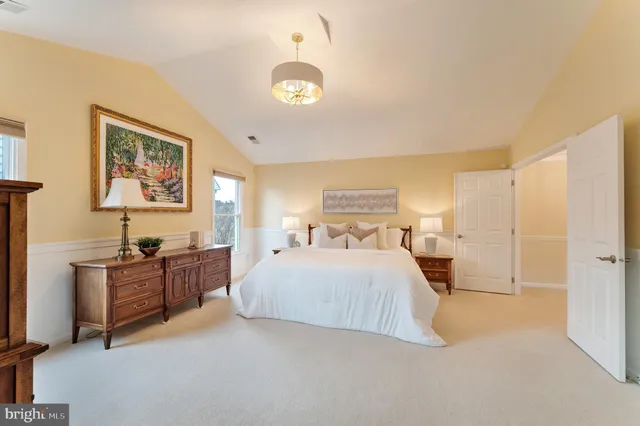 a view of a white house with a yard