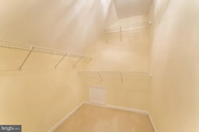 a front view of a house with a garden and plants