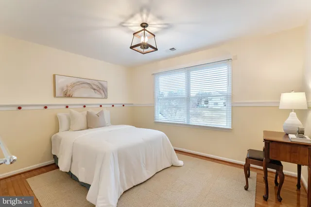 a view of a park with slide and a bench