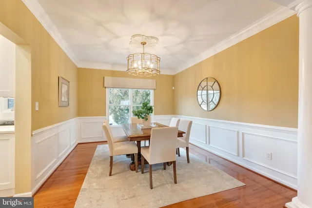 a kitchen with a sink a refrigerator and a stove top oven