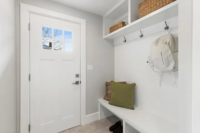 a bedroom with furniture and wooden floor