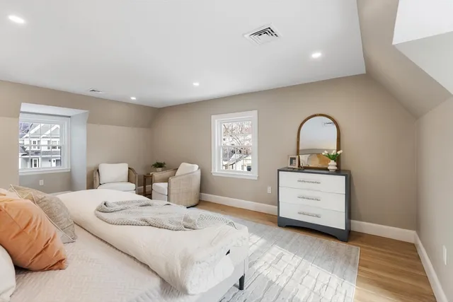 a view of a room with wooden floor