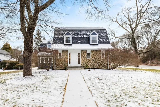 a view of house with snow on the road