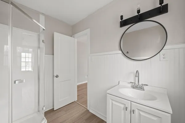 wooden floor in an empty room with a window