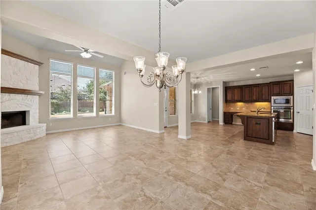 a view of a kitchen with a sink and a kitchen view