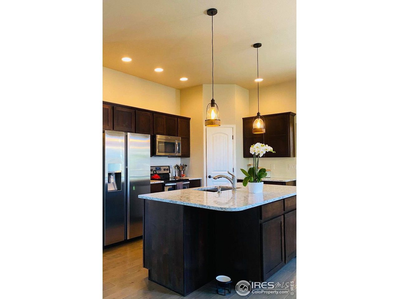 505 Deville Drive Greeley, CO 80634 - Photo 12 of 39 a bathroom with a sink a mirror and shower