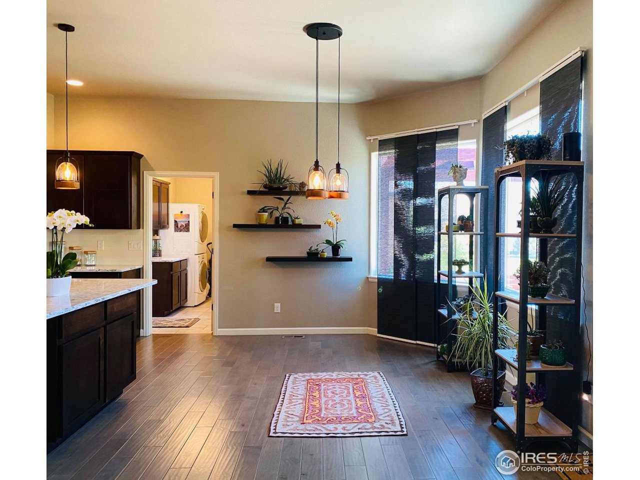 505 Deville Drive Greeley, CO 80634 - Photo 17 of 39 a kitchen with stainless steel appliances granite countertop a refrigerator and a stove top oven