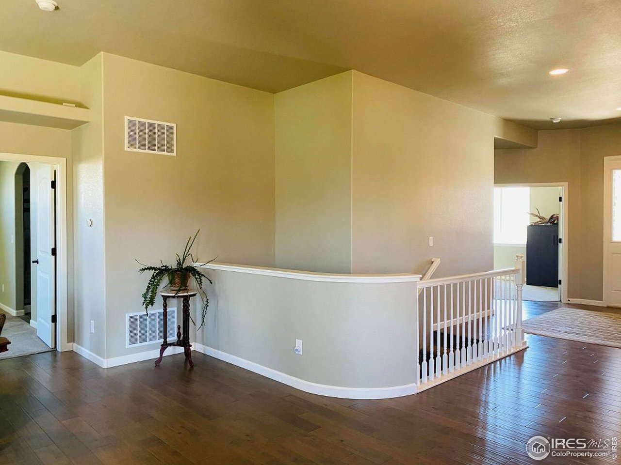 505 Deville Drive Greeley, CO 80634 - Photo 19 of 39 a view of livingroom with furniture and wooden floor