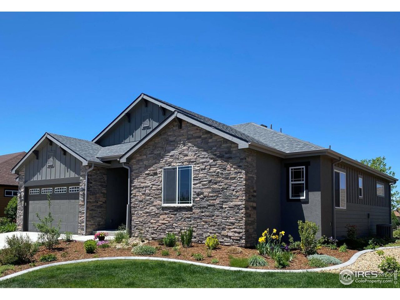 505 Deville Drive Greeley, CO 80634 - Photo 2 of 39 a front view of a house with a yard