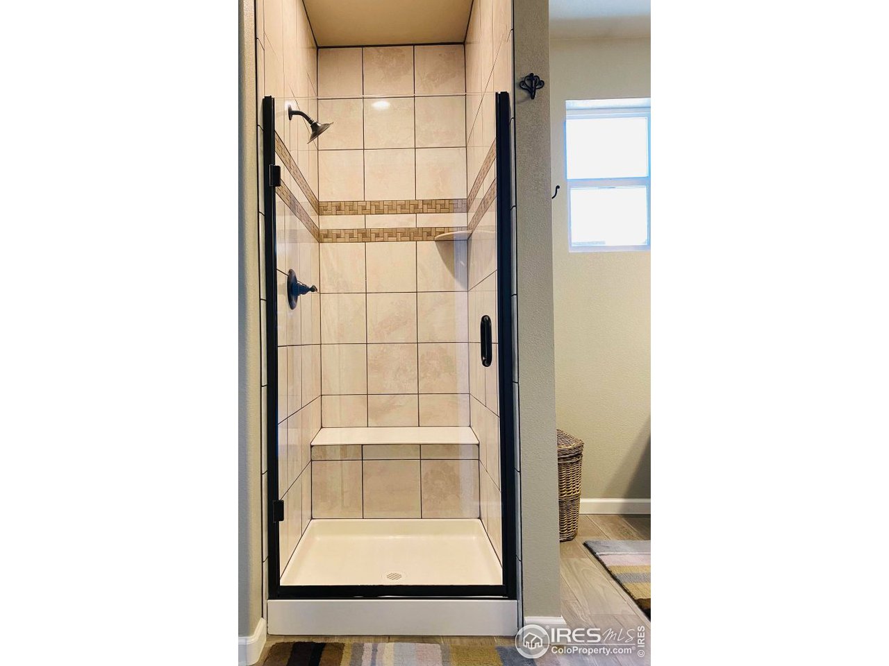 505 Deville Drive Greeley, CO 80634 - Photo 25 of 39 a picture of a bathroom with a shower and a window