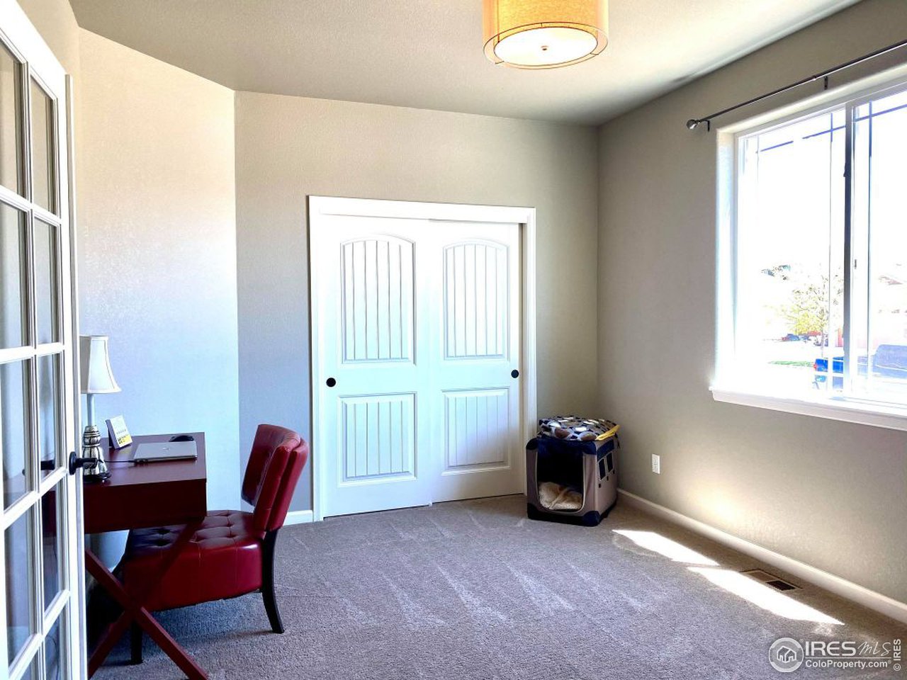 505 Deville Drive Greeley, CO 80634 - Photo 26 of 39 a view of a workspace with furniture and a window