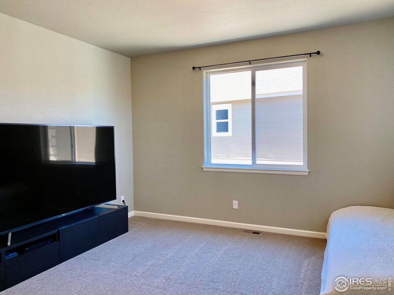 505 Deville Drive Greeley, CO 80634 - Photo 28 of 39 an empty room with windows