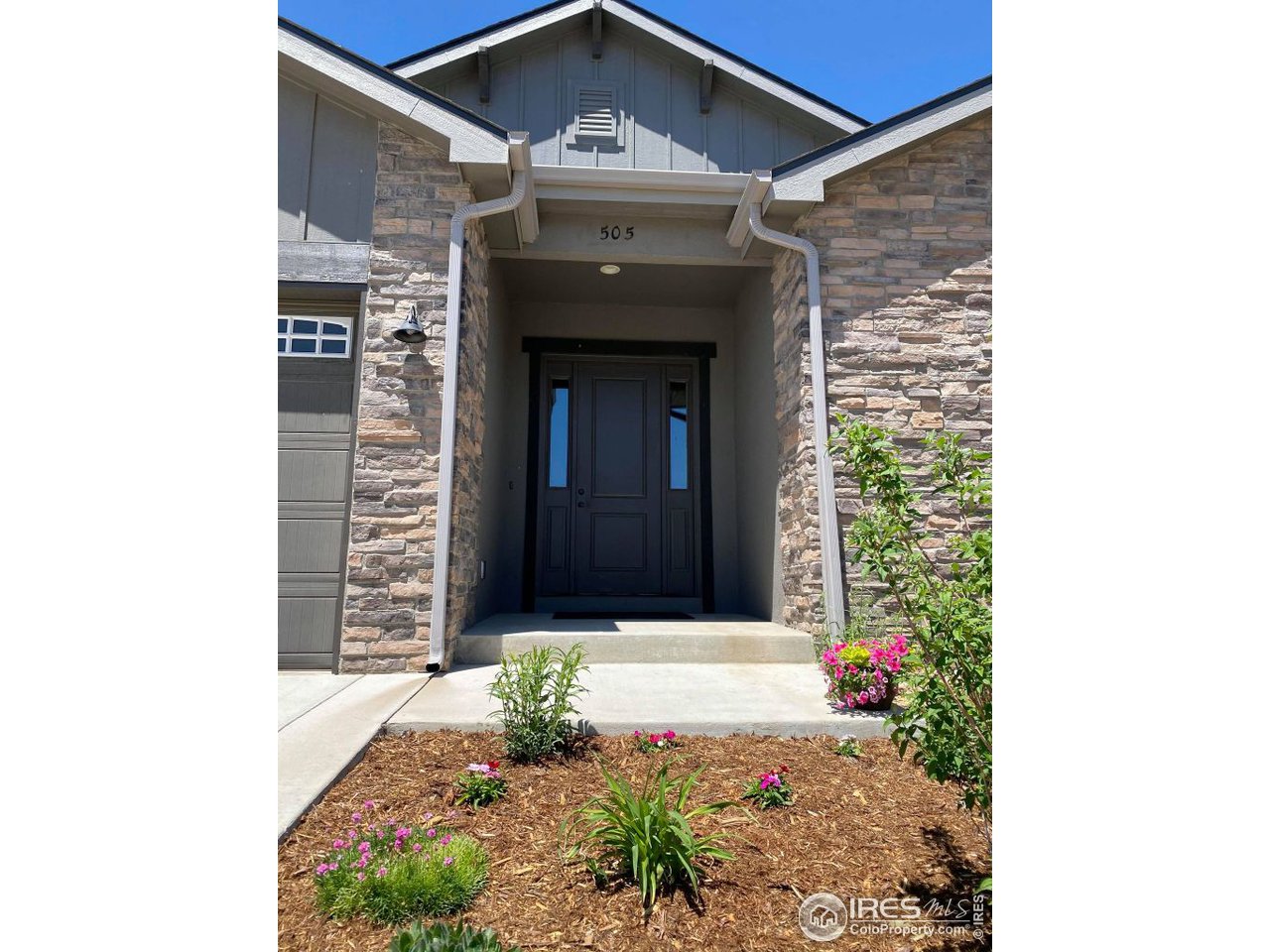 505 Deville Drive Greeley, CO 80634 - Photo 3 of 39 a front view of a house with a yard