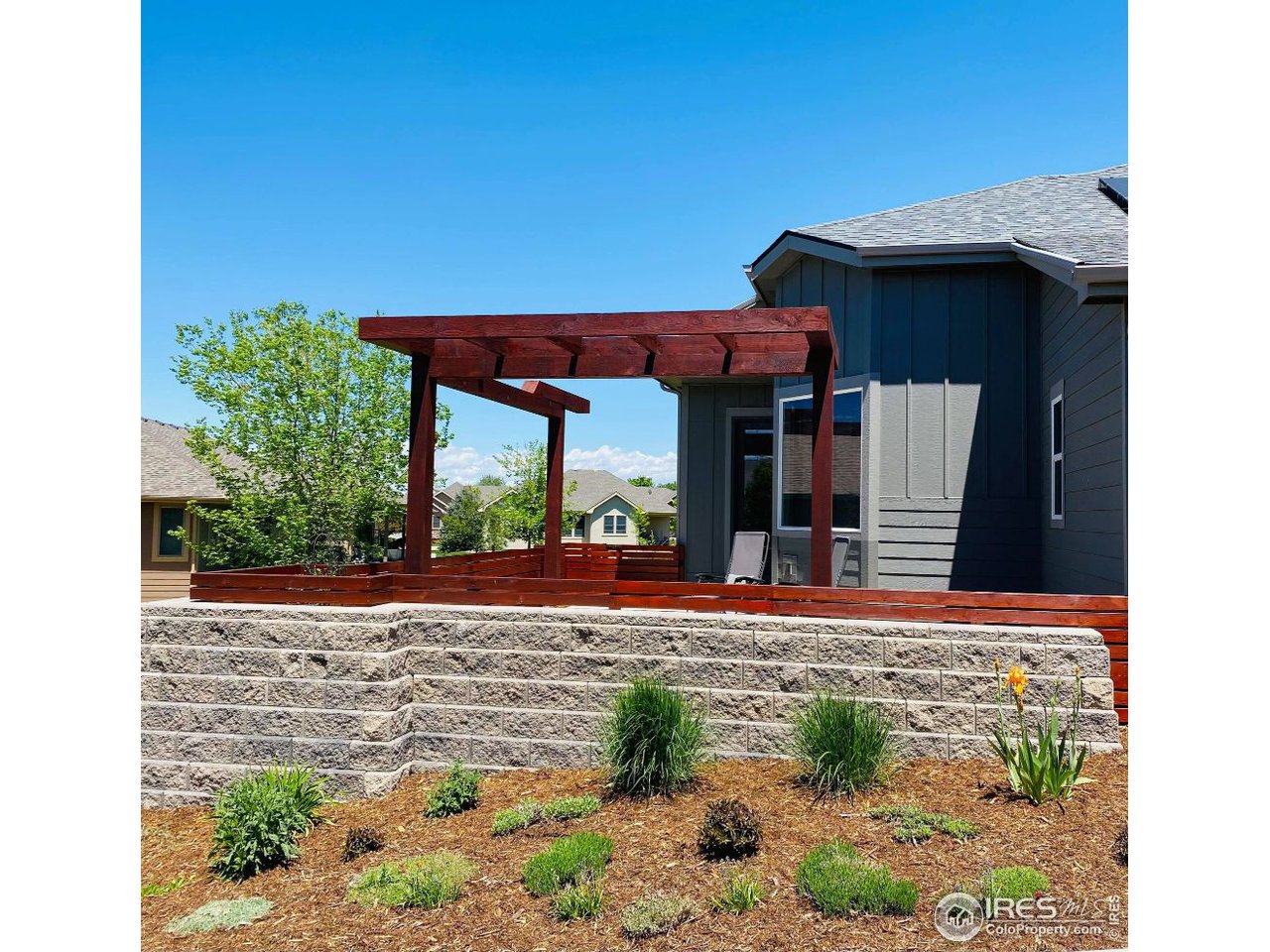 505 Deville Drive Greeley, CO 80634 - Photo 38 of 39 a view of a house with backyard and sitting area