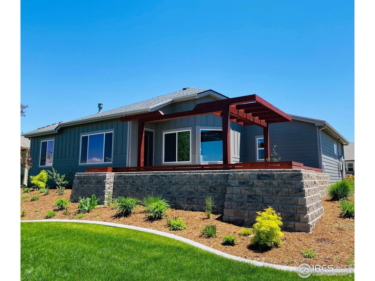 505 Deville Drive Greeley, CO 80634 - Photo 39 of 39 a front view of a house with a yard and porch
