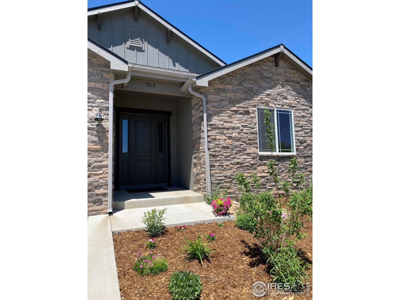 505 Deville Drive Greeley, CO 80634 - Photo 4 of 39 a front view of a house with windows