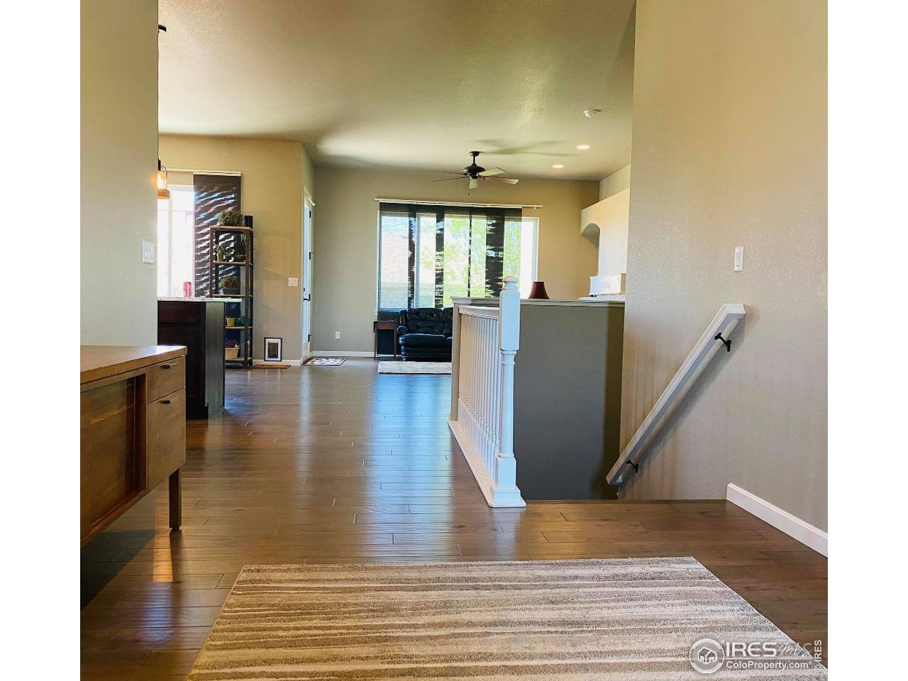 505 Deville Drive Greeley, CO 80634 - Photo 6 of 39 a view of kitchen with furniture and wooden floor