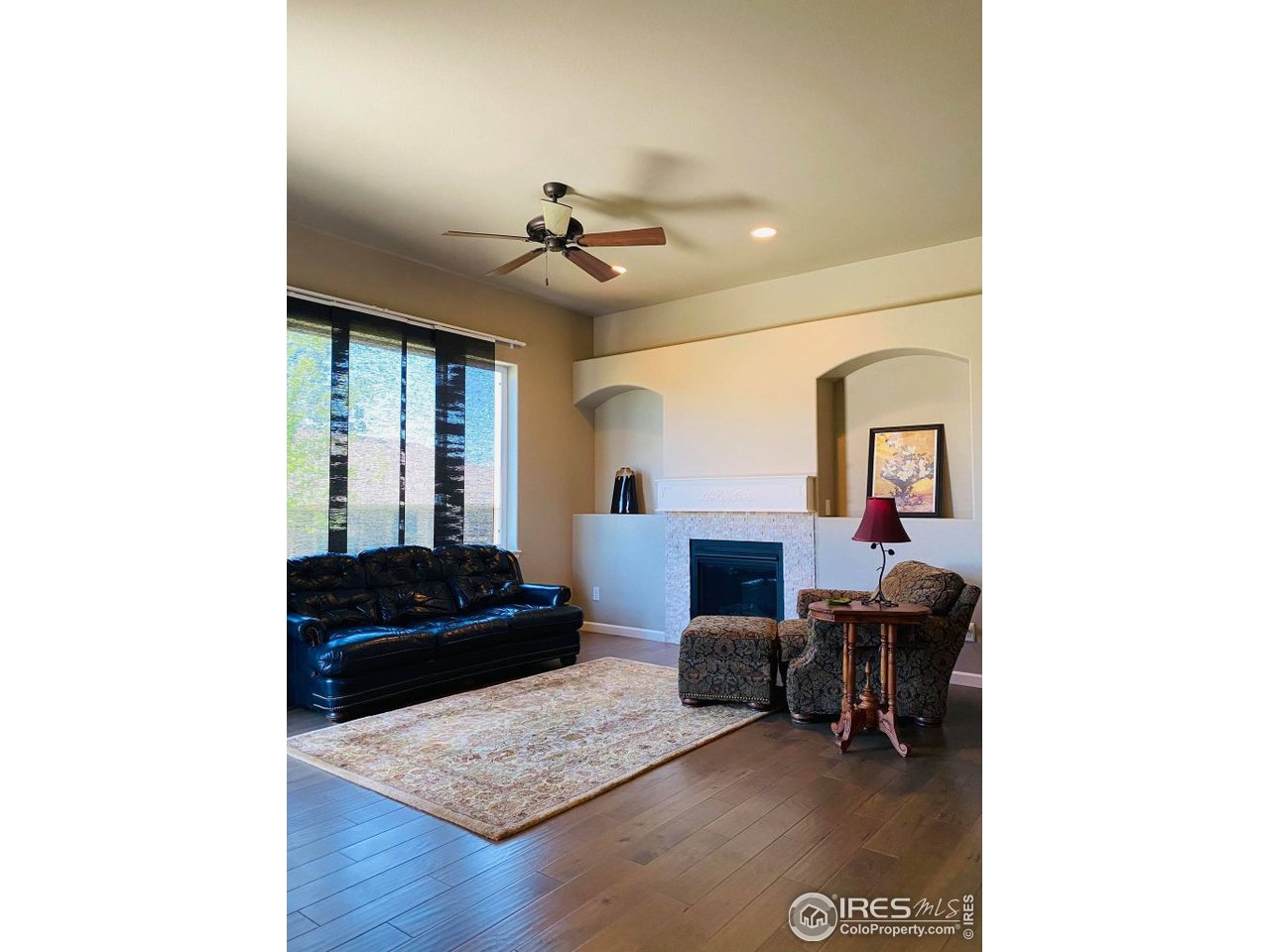 505 Deville Drive Greeley, CO 80634 - Photo 9 of 39 a living room with furniture and a rug