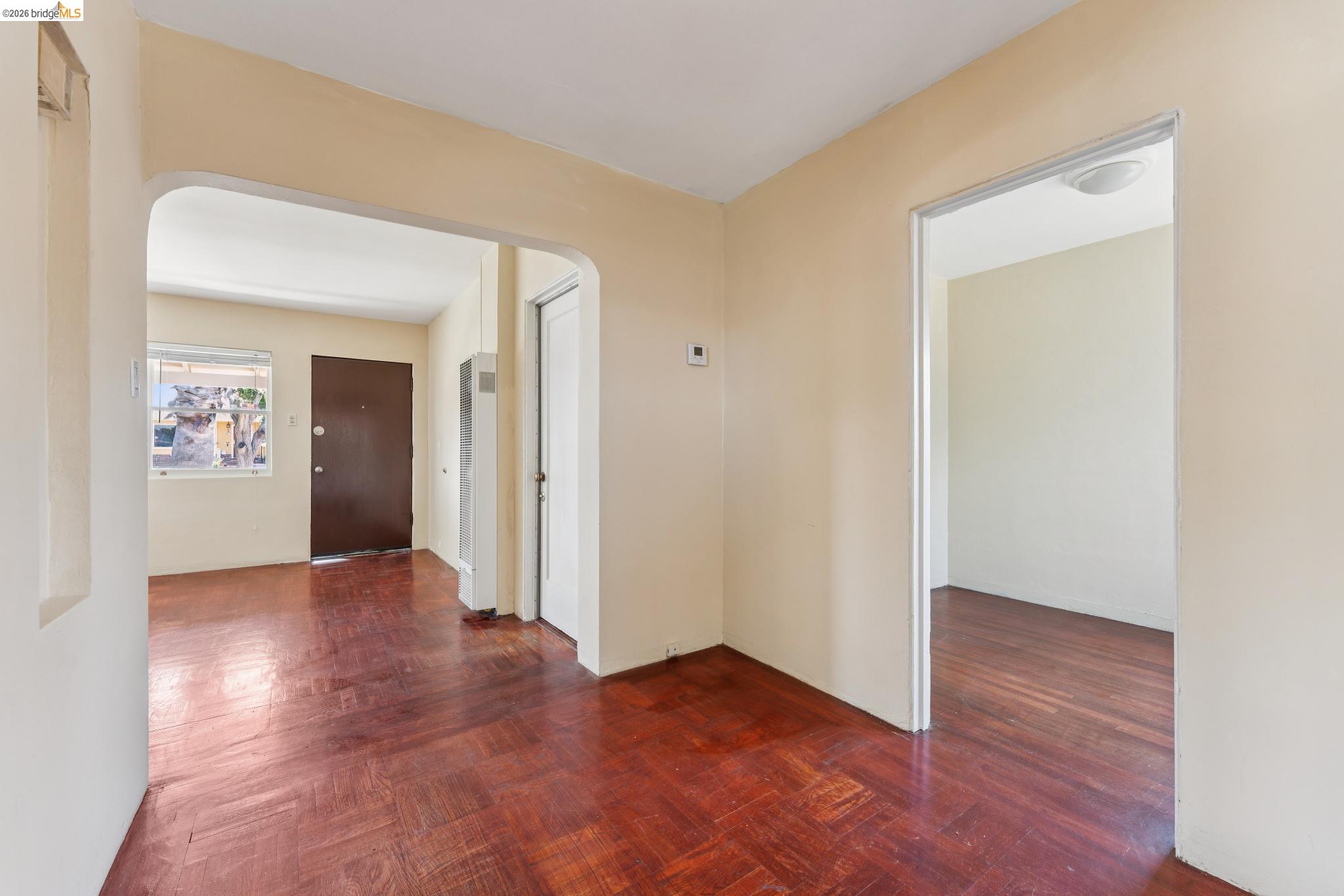 2879 Rheem Avenue Richmond, CA 94804 - Photo 15 of 45 Interior space featuring wood-finish flooring, light-colored walls, and a visible doorway to another room
