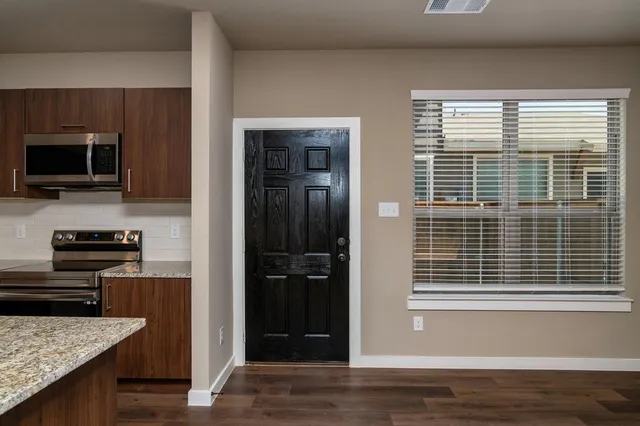 a view of kitchen and utility room
