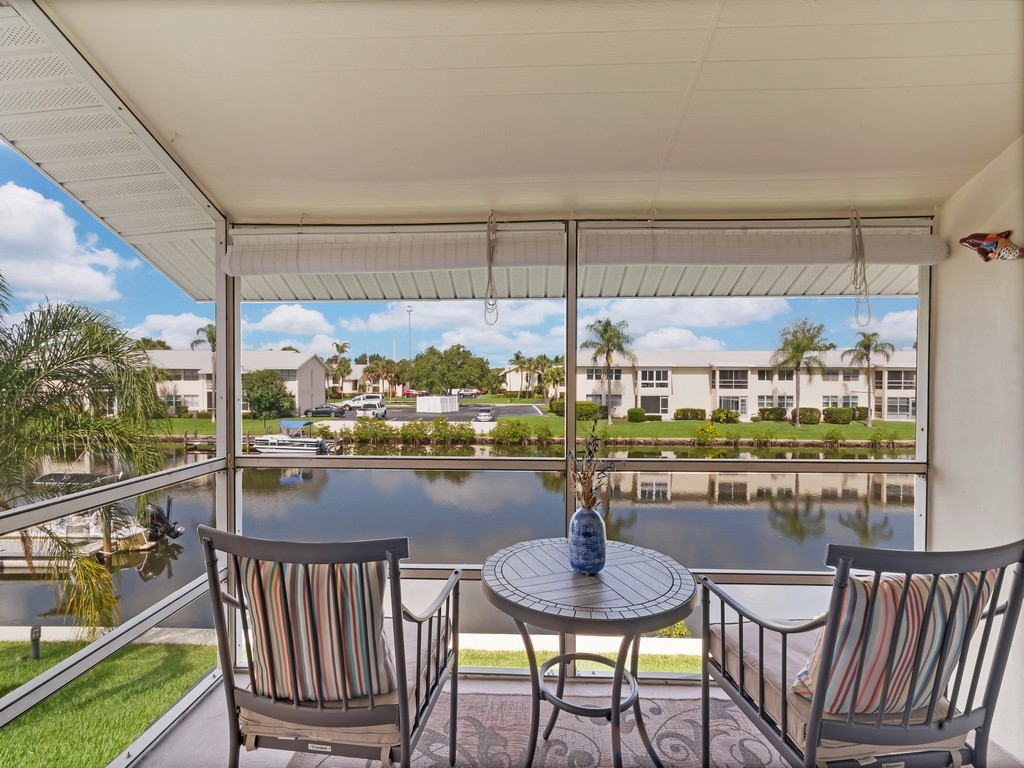 1845 Cobia Drive, Unit 202G Vero Beach, FL 32960 - Photo 1 of 27 a room with lots of table and chairs
