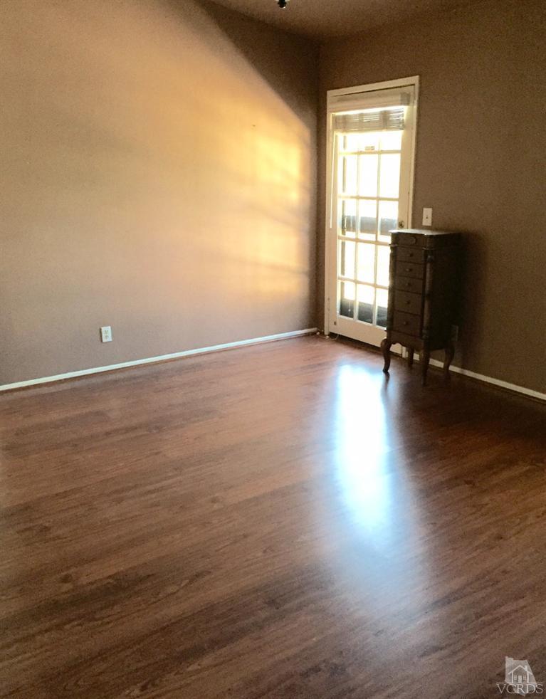 823 Warren Court Moorpark, CA 93021 - Photo 13 of 20 a view of room with window and wooden floor
