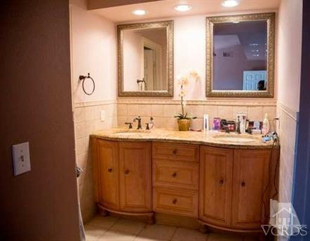 823 Warren Court Moorpark, CA 93021 - Photo 14 of 20 a bathroom with a sink and a mirror