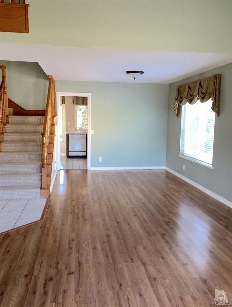 823 Warren Court Moorpark, CA 93021 - Photo 4 of 20 wooden floor in an empty room with a window