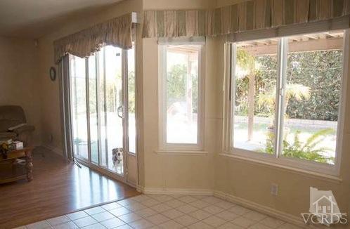 823 Warren Court Moorpark, CA 93021 - Photo 6 of 20 a view of an entryway with wooden floor and windows