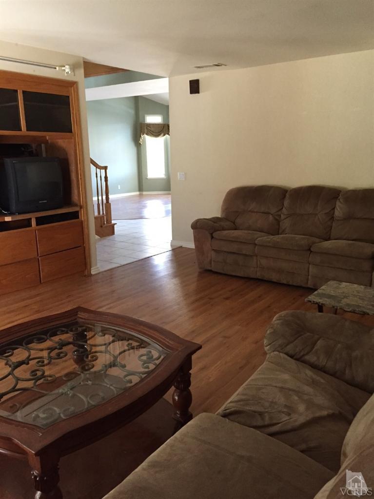 823 Warren Court Moorpark, CA 93021 - Photo 9 of 20 a living room with furniture and a flat screen tv