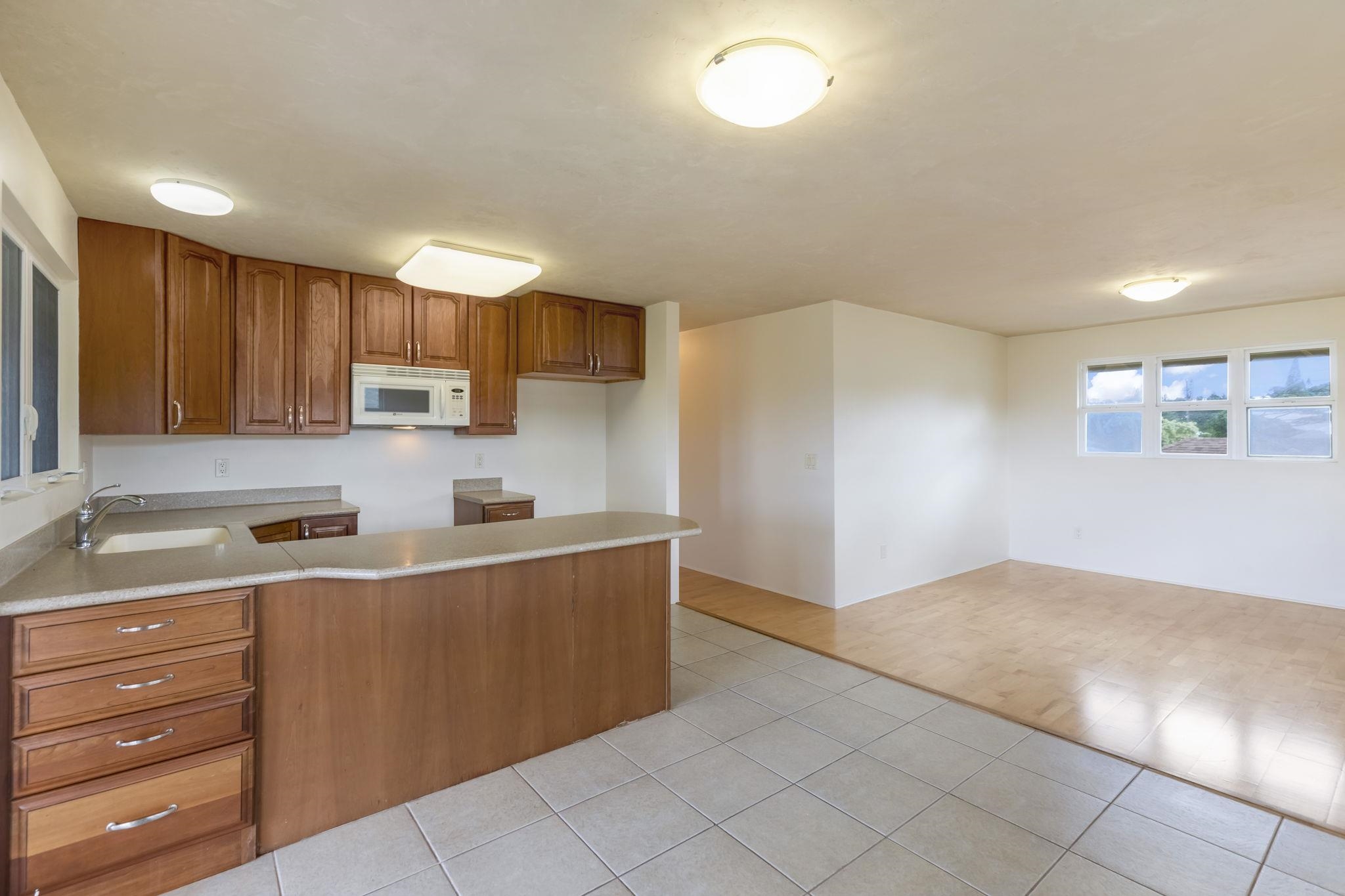 44 Pokoa Place Haiku, HI 96708 - Photo 12 of 29 a kitchen with stainless steel appliances granite countertop a sink and cabinets